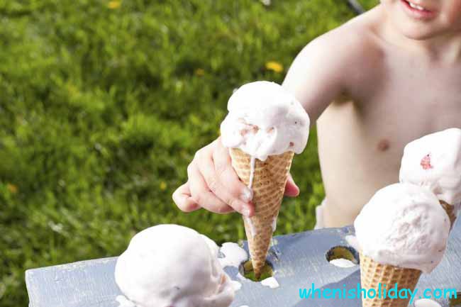 Kid taking Strawberry Ice Cream