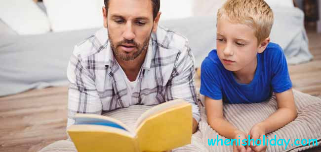 dad reading to son