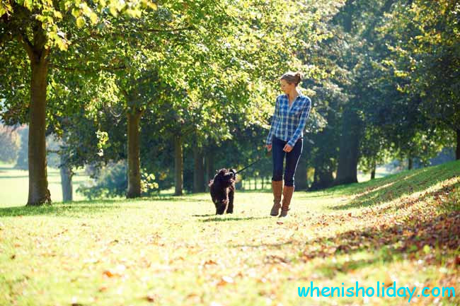 girl with her dog in park