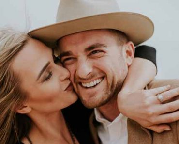 woman kissing a man